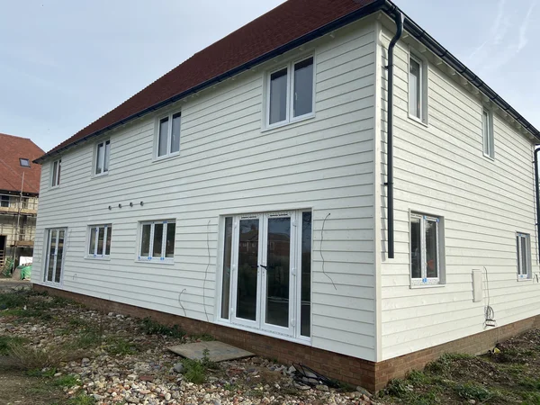 View of modern semi-detached houses for sale in Lydd with driveway and garden space